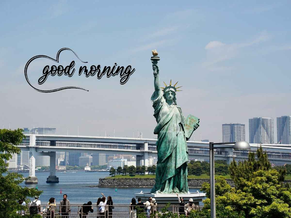 Statue of liberty under clear blue sky, captioned "good morning" in christian good morning images.