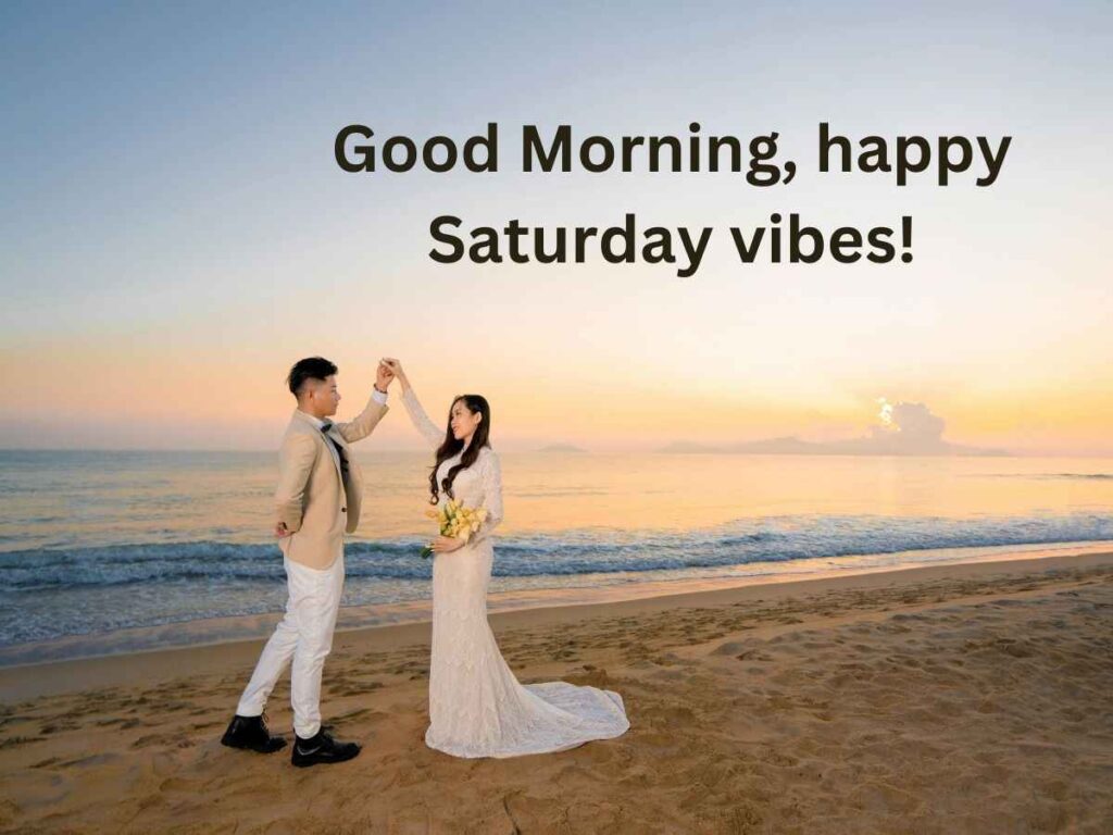 A serene sunrise over a calm lake, with the words "good morning, saturday blessings" written in elegant script.