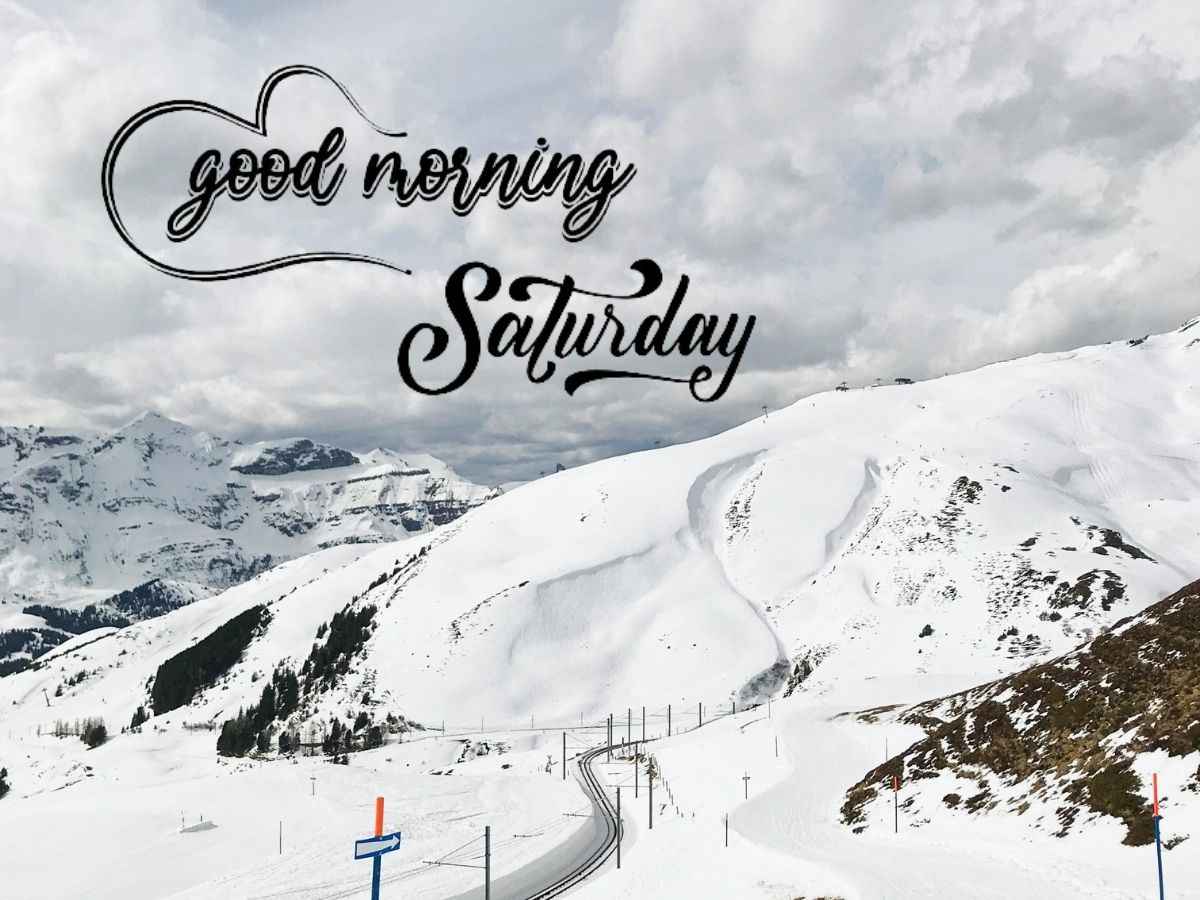Scenic view of snow-covered mountains and trees with "good morning saturday" text, ideal for winter images.