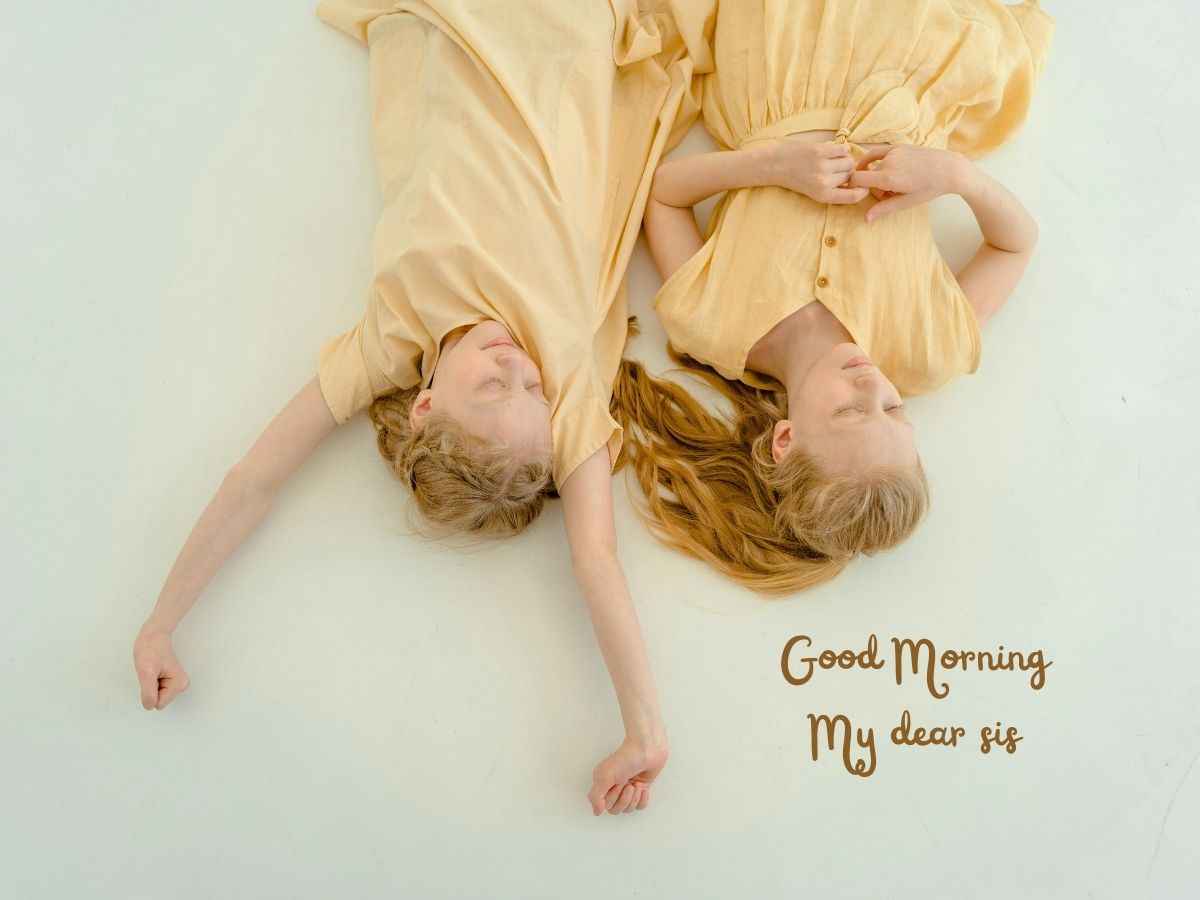 Two girls lying on their stomachs, smiling, with the phrase "Good morning my year" displayed above them.